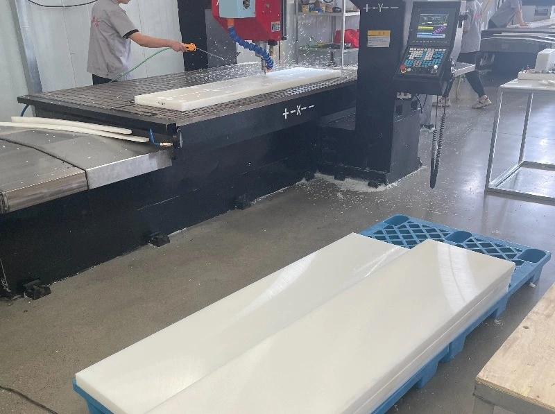 Close view of machined UHMWPE surface with rough texture and tool marks