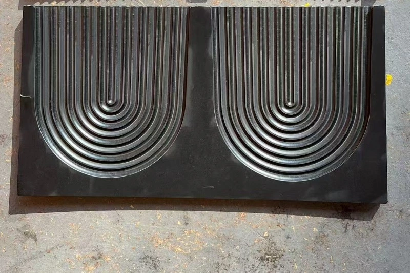 Warped white UHMWPE blocks showing machining deformation patterns