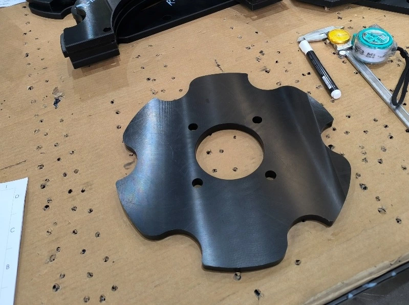 UHMWPE component showing fibrous and smeared surface finish due to machining