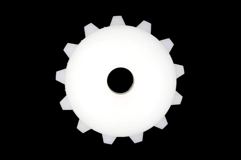 UHMWPE gears and sprockets with wear resistance on metal workbench